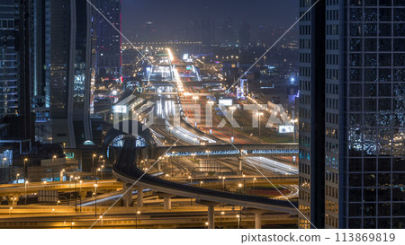 Dubai downtown skyline night to day timelapse and Sheikh Zayed road traffic, UAE 113869819