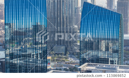 Dubai downtown skyline at sunset timelapse with tallest building and Sheikh Zayed road traffic, UAE 113869852