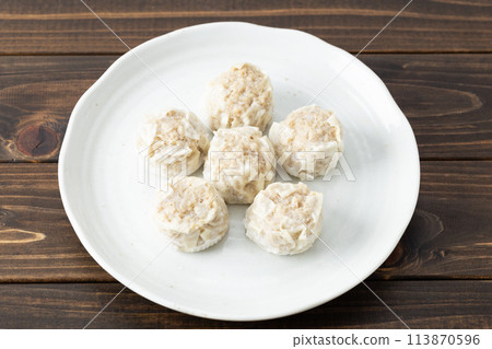 Frozen shumai on wood background 113870596