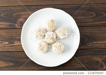 Frozen shumai on wood background 113870597
