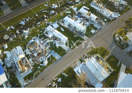 Destroyed by hurricane Ian suburban houses in Florida mobile home residential area. Consequences of natural disaster 113870914