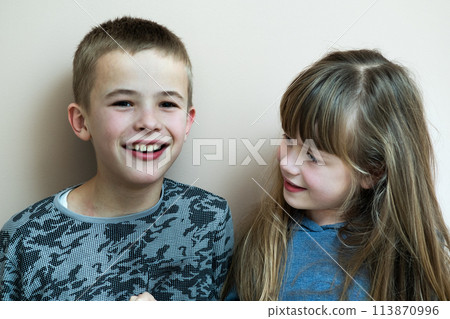 Two children boy and girl fooling around having fun together. Happy childhood concept. 113870996