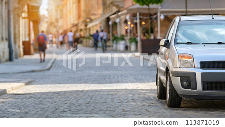 Close up of a car parked illegally against traffic rules on pedestrian city street side. Close up of a car parked illegally against traffic rules on pedestrian city street side. 113871019