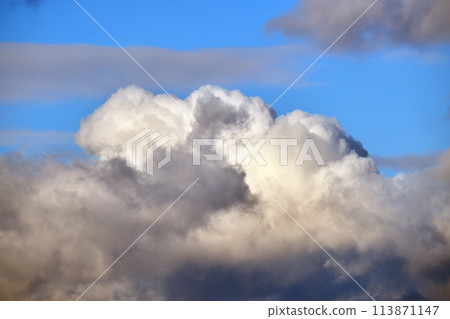Bright landscape of white puffy cumulus clouds on blue clear sky 113871147