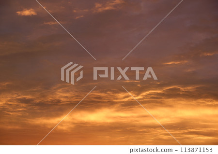Bright colorful sunset sky with rays of setting sun and vivid dark clouds Bright colorful sunset sky with rays of setting sun and vivid dark clouds 113871153