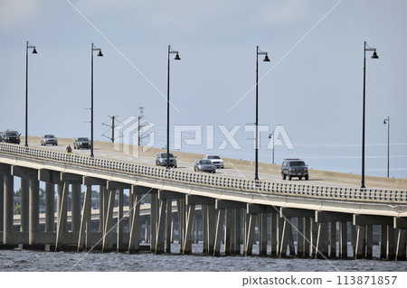 Barron Collier Bridge and Gilchrist Bridge in Florida with moving traffic. Transportation infrastructure in Charlotte County connecting Punta Gorda and Port Charlotte over Peace River 113871857