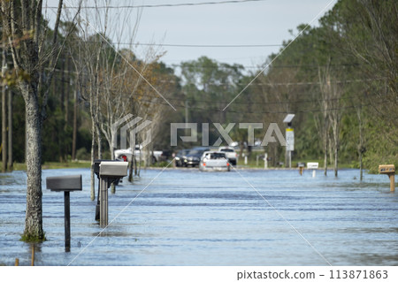 Hurricane flooded street in Florida residential area. Consequences of natural disaster Hurricane flooded street in Florida residential area. Consequences of natural disaster 113871863