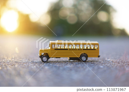 Model of classical american yellow school bus for transporting of kids to and from school every day. Concept of education in the USA Model of classical american yellow school bus for transporting of kids to and from school every day. Concept of education in the USA 113871967