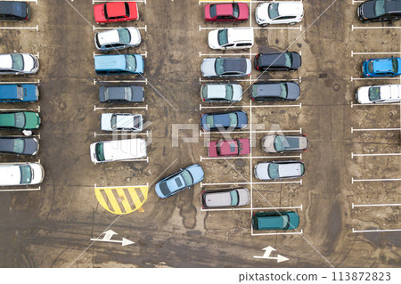 Top down aerial view of many cars on a parking lot of supermarket or on sale car dealer market. 113872823