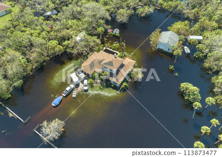 Surrounded by hurricane Ian rainfall flood waters homes in Florida residential area. Aftermath of natural disaster 113873477