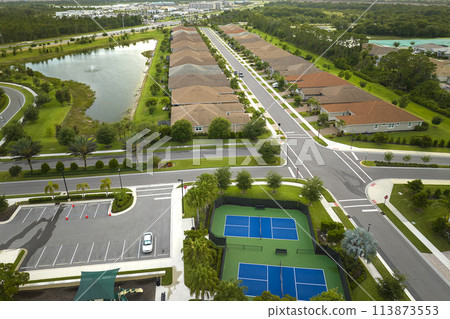 Aerial view of blue tennis courts for sports recreational activity 113873553