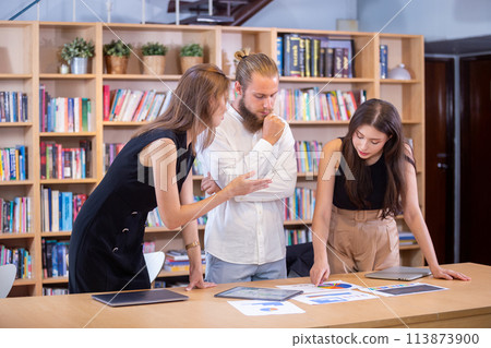Business people brainstorming analysis chart strategy marketing at table office. Business people brainstorming analysis chart strategy marketing at table office. 113873900