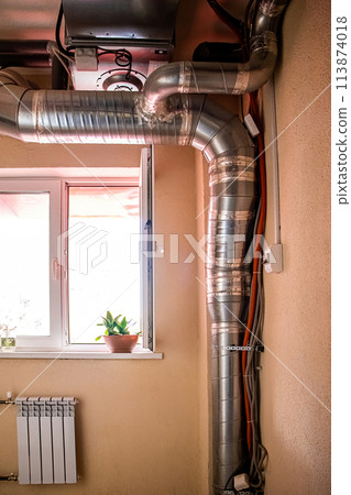 Ventilation pipes in building. Heating and cooling distribution ducts. 113874018