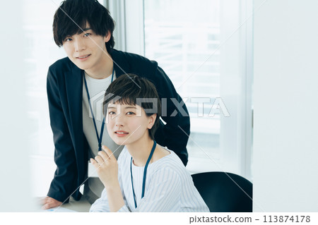 Office worker facing a computer 113874178
