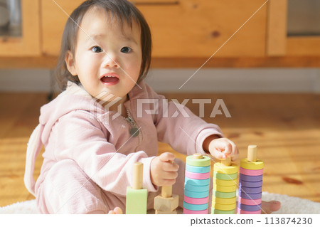 Baby playing with building blocks 113874230