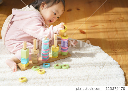 Baby playing with toys Baby playing with toys 113874478