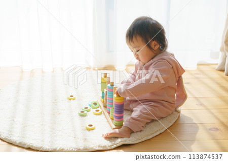 Baby playing with toys 113874537