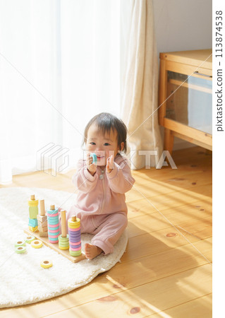 Baby playing with toys Baby playing with toys 113874538