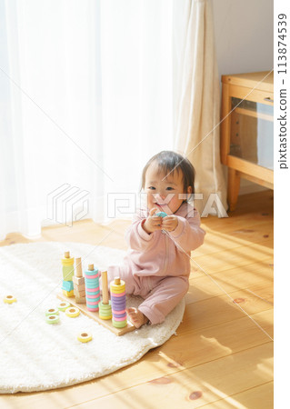 Baby playing with toys 113874539