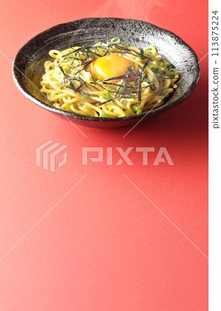 Hot oil soba noodles topped with egg yolk, shredded seaweed, and spring onions Hot oil soba noodles topped with egg yolk, shredded seaweed, and spring onions 113875224