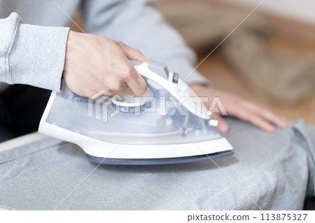 Man ironing body parts iron 113875327