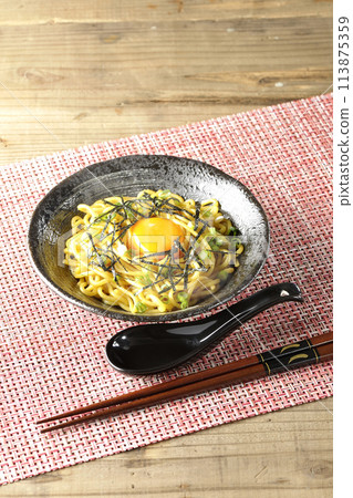 Hot oil soba noodles topped with egg yolk, shredded seaweed, and spring onions Hot oil soba noodles topped with egg yolk, shredded seaweed, and spring onions 113875359