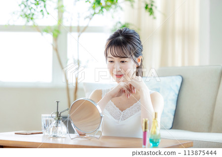 Woman relaxing at home Woman relaxing at home 113875444
