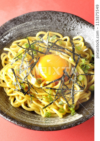 Aerial view of hot oil noodles topped with egg yolk, shredded seaweed, and green onions 113875549