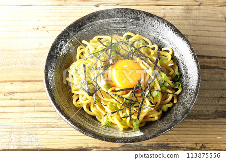 Aerial view of hot oil noodles topped with egg yolk, shredded seaweed, and green onions Aerial view of hot oil noodles topped with egg yolk, shredded seaweed, and green onions 113875556
