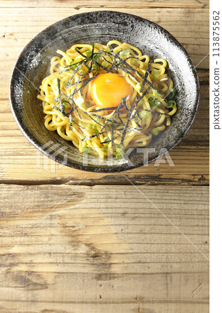 Aerial view of hot oil noodles topped with egg yolk, shredded seaweed, and green onions Aerial view of hot oil noodles topped with egg yolk, shredded seaweed, and green onions 113875562