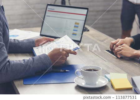 Happiness two businessman working together confident team meeting in office desk. Team business man partners working with laptop startup company. Asian man colleague friendship at work staff meeting Happiness two businessman working together confident team meeting in office desk. Team business man partners working with laptop startup company. Asian man colleague friendship at work staff meeting 113877531