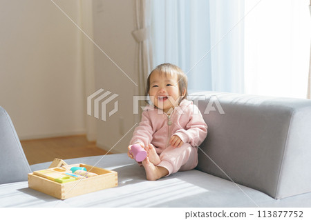 Baby playing with building blocks 113877752