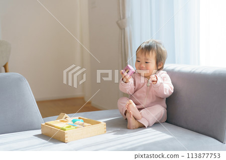 Baby playing with building blocks 113877753