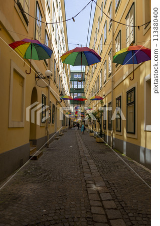 A street in Vienna with suspended umbrellas 113880400