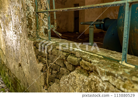 Old metal window from an abandoned building Old metal window from an abandoned building 113880529