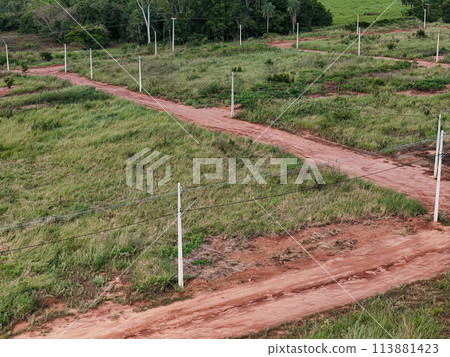ew subdivision for houses, dirt road and power poles 113881423