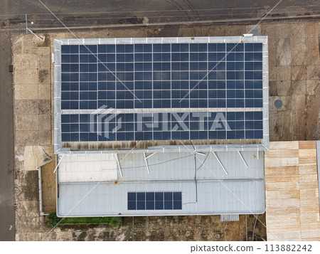 metal roof with many solar panels 113882242