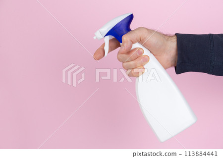 A man hand cleaning squeezing a spray bottle 113884441