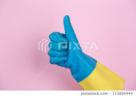 A hand with cleaning gloves making the OK gesture 113884444