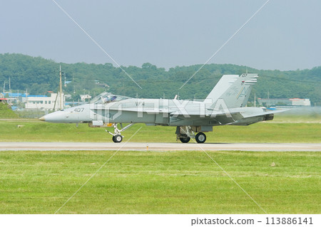 A US Navy F/A-18C Hornet taxiing. 113886141