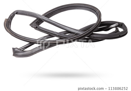 Rolled up black rubber sealant for elements of the car body, doors or trunk, for noise insulation, thermal and sound, preventing heat loss in the car interior. Sealing gasket for repair in a workshop. 113886252