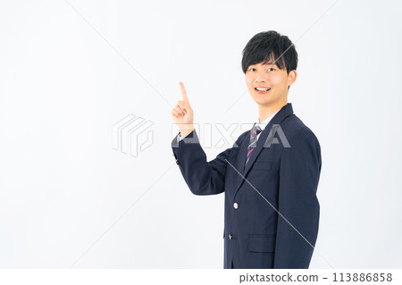 Male student pointing at white background 113886858