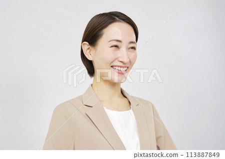 Portrait of a middle-aged smiling businesswoman on white background Portrait of a middle-aged smiling businesswoman on white background 113887849