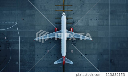 Top down view on commercial airplane docking in terminal in the parking lot of the airport apron, waiting for services maintenance, refilling fuel services after airspace lock down 113889153