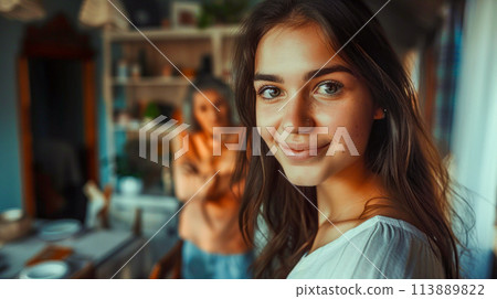 Close up of person holding cell phone near statue of woman. Close up of person holding cell phone near statue of woman. 113889822
