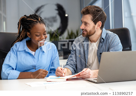 Multicultural colleagues using laptop for creating new business project Multicultural colleagues using laptop for creating new business project 113890257