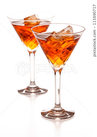Refreshing Bourbon Manhattan cocktail with vermouth and maraschino cherry garnish isolated on white background 113890717