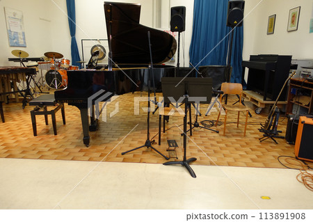 We always have fun singing together and playing instruments in the school music room. 113891908