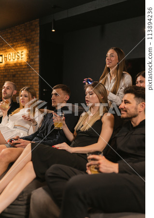 Friends gather to engage in epic virtual battles with beverages 113894236