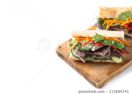 Vietnamese banh mi sandwich isolated on white background. Copy space Vietnamese banh mi sandwich isolated on white background. Copy space 113894741